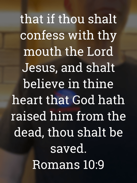 The image bears the text:
that if thou shalt confess with thy mouth the Lord Jesus, and shalt believe in thine heart that God hath raised him from the dead, thou shalt be saved.
Romans 10:9
The background is a selfie of Gary Lum wearing a NASA T-shirt.